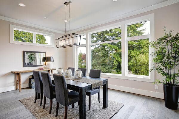 Modern dining room featuring expansive energy-efficient casement windows